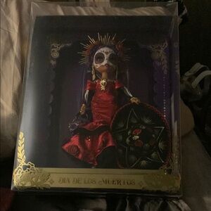 Red and Black Collectible Doll with Accessories